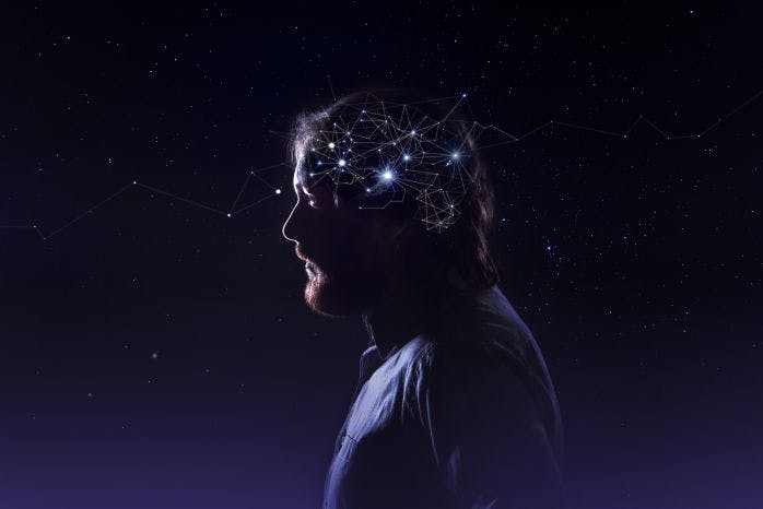 imagem de homem com o universo representando seu cérebro